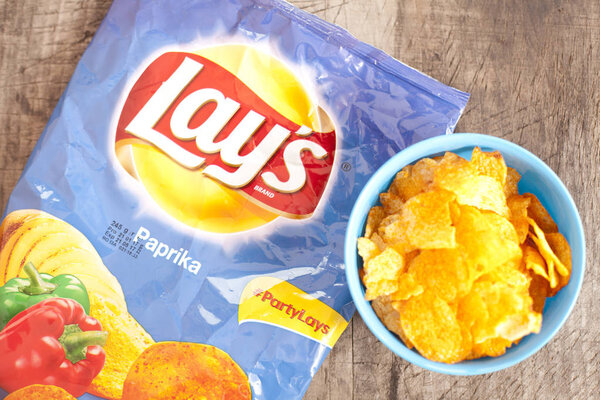 DORKOVO, BULGARIA - MARCH 13, 2017: Bag of 10 OZ Frito Lay Paprika potato chips. Frito-Lay is the worlds largest distributed snack food.