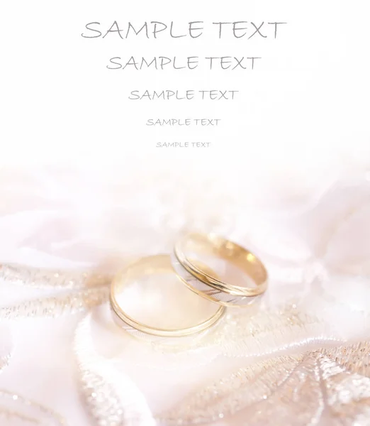 gold wedding rings invitation card with space for text. wedding invitation.