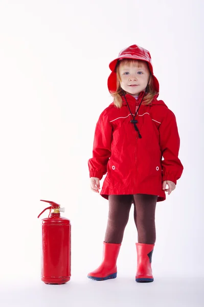 Little serious firefighter on white background — Stock Photo, Image