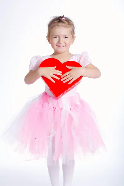 Beautiful young girl with heart — Stock Photo, Image