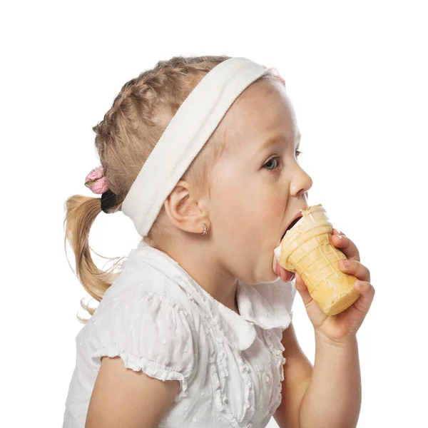 Little girl eating icecream on white — Stock Photo, Image
