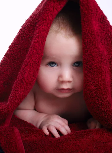 Cute baby with red towel — Stock Photo, Image