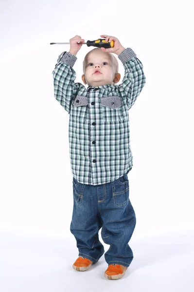Little boy with screwdriver on white — Stock Photo, Image