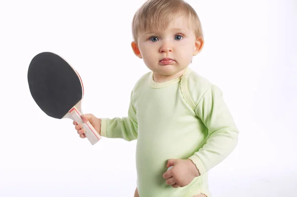 Hermoso bebé con raqueta de tenis de mesa —  Fotos de Stock