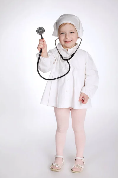 Cute little girl playing doctor — Stock Photo, Image