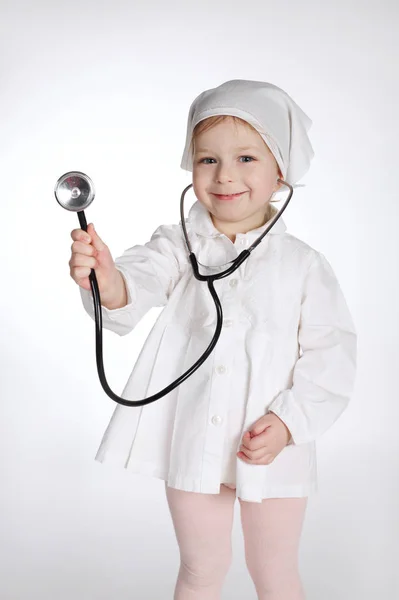 Cute little girl playing doctor Stock Photo