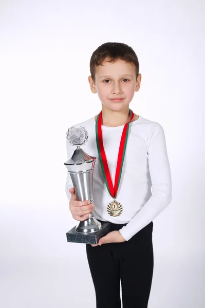 Young winner on white background — Stock Photo, Image