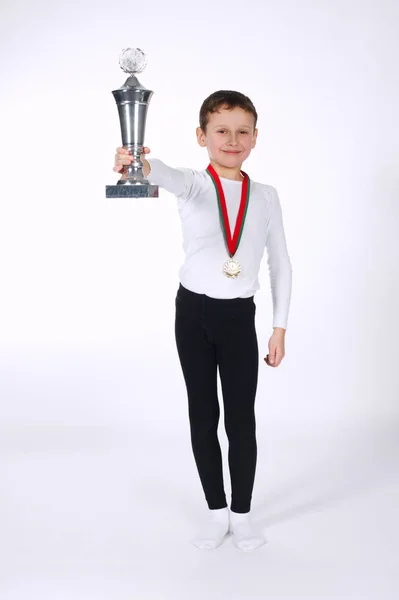 Young winner on white background — Stock Photo, Image