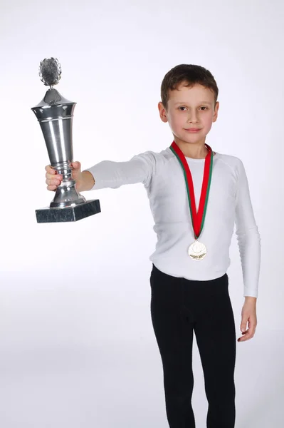 Young winner on white background — Stock Photo, Image