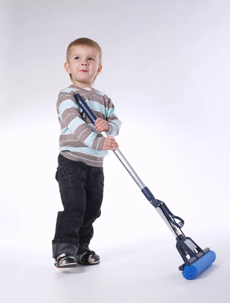 Little boy with mop on white — Stock Photo, Image