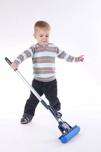 Little boy with mop on white — Stock Photo, Image