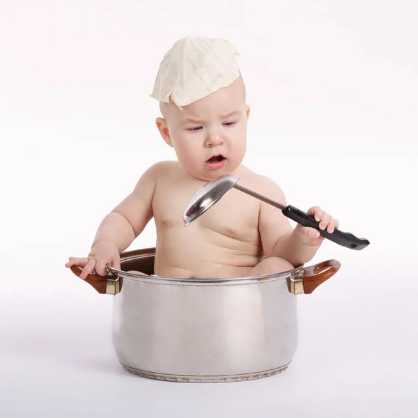 Little funny boy sitting in pan — Stock Photo, Image