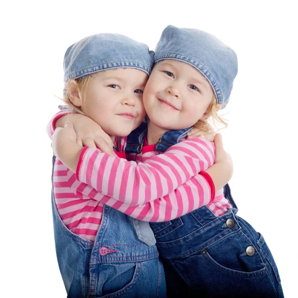 Beyaz arka plan üzerinde izole küçük ikiz kız — Stok fotoğraf