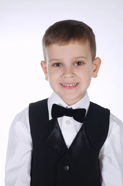 Little boy with bow tie on white — Stock Photo, Image