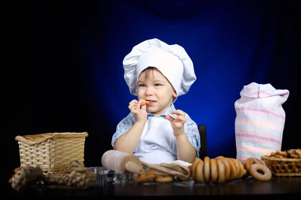 Young funny cook with kitchenware — Stock Photo, Image