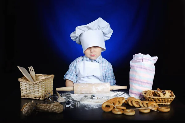 Young funny cook with kitchenware — Stock Photo, Image