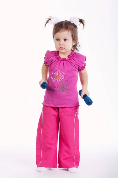 Little girl lifting dumbbells Isolated on white background — Stock Photo, Image