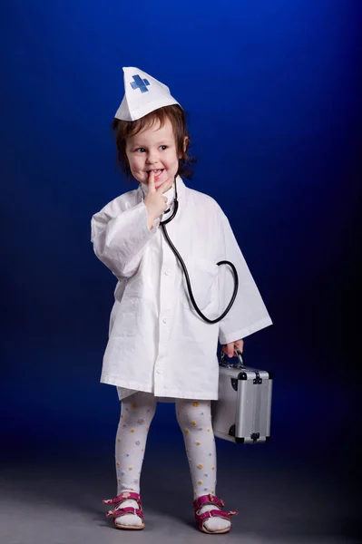 Little girl with doctors uniform — Stock Photo, Image