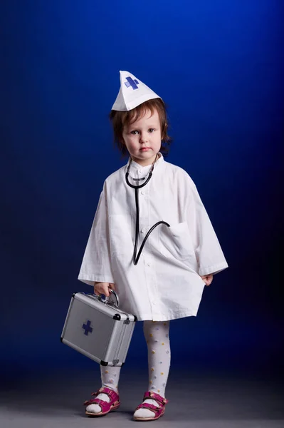 Little girl with doctors uniform — Stock Photo, Image