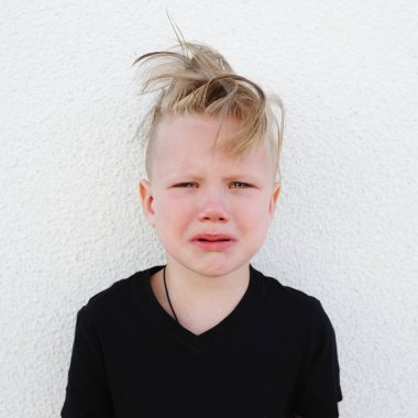 young emotional boy on bright background clipart