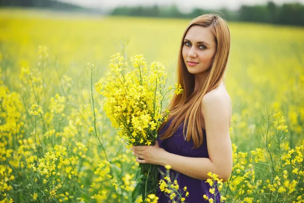 Beautiful blonde girl on summer meadow — Stock Photo, Image