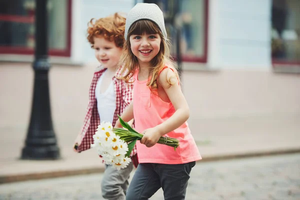 Two cute little hipsters running away — Stock Photo, Image