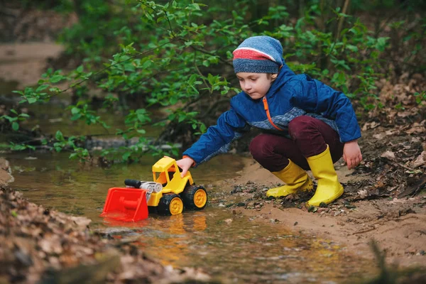 Little boy playing with toy truck — Stock Photo, Image