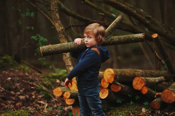 Little sweet lumberjack in autumn forest — Stock Photo, Image