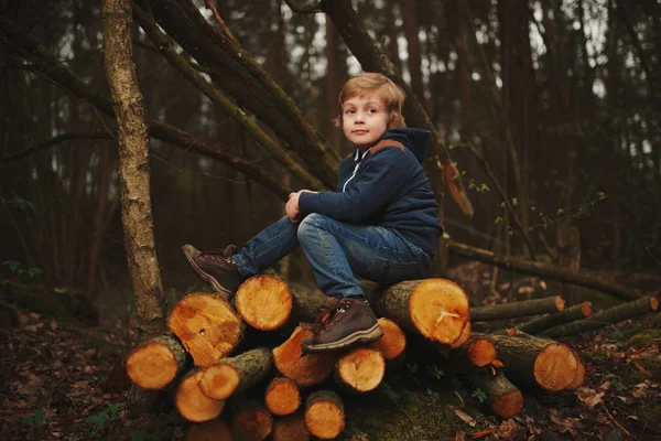 Little sweet lumberjack in autumn forest — Stock Photo, Image