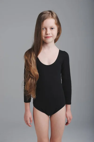 Little girl studio portrait on grey background — Stock Photo, Image