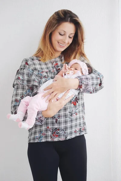 Young mother with cute newborn baby — Stock Photo, Image