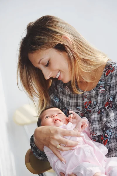 Young mother with cute newborn baby — Stock Photo, Image