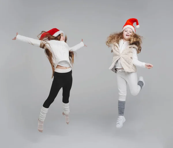 Cute happy children with santa hats — Stock Photo, Image
