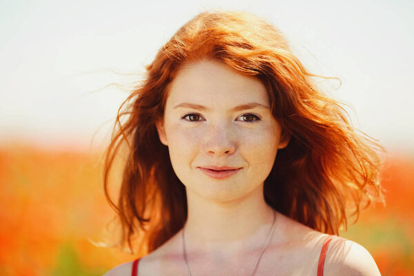 beautiful girl in poppy field