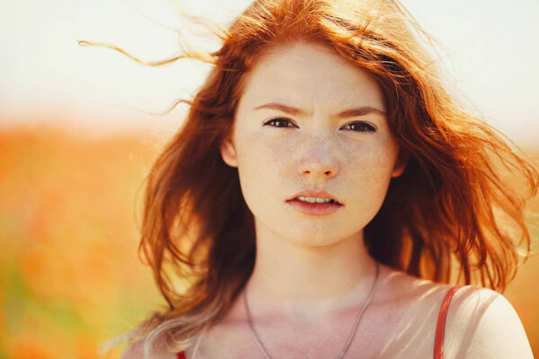 beautiful girl in poppy field