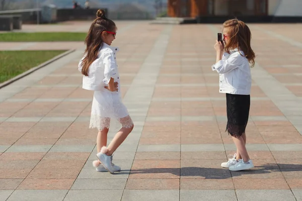 Stylish funny little girls on the street — Stock Photo, Image