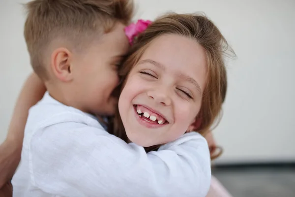 Young happy boy and girl together outside — Stock Photo, Image