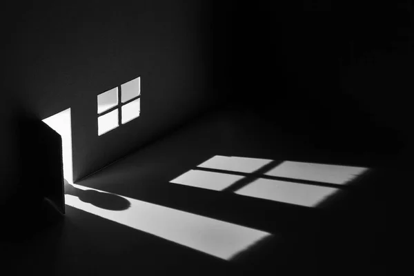 Toy house with light falling through door and window to make a s — Stock Photo, Image