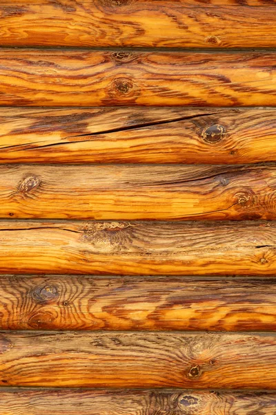 Background log wall, round timber texture.