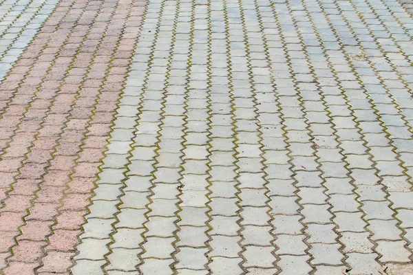 Yol dokusu, beton kaldırım taş gri arka plan. Mesafeye perspektif.