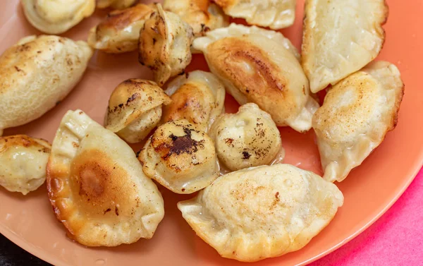 Fried ravioli on a plate, fried pies food.