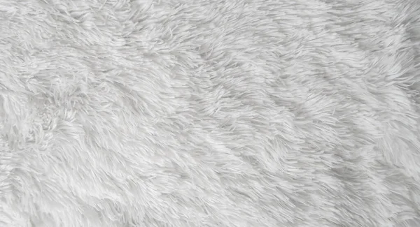 Fluffy fur texture for designers, close-up, white wool rug. White wool with white top background texture. . White seamless cotton.