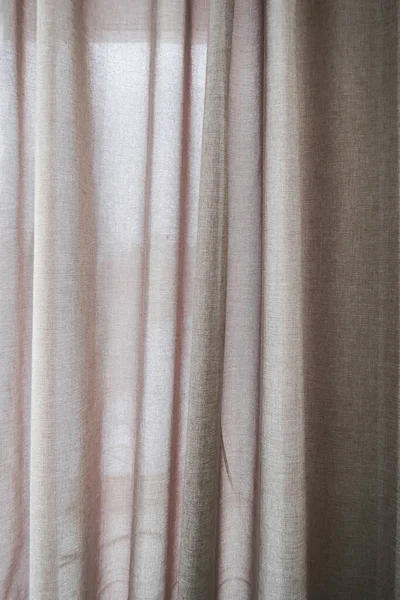 Curtains for windows as a background. The texture of linen curtains.