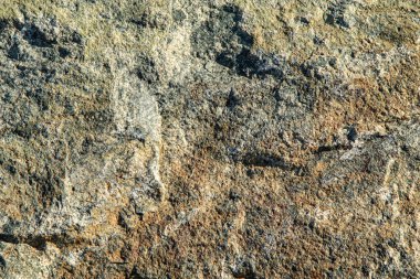 Arkaplan olarak gri kahverengi granit taş dokusu.