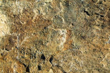 Arkaplan olarak gri kahverengi granit taş dokusu.