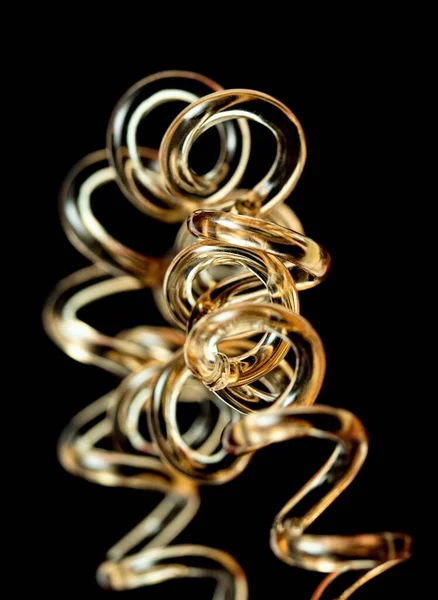 Plastic Wire Curled Black Background — Stock Photo, Image