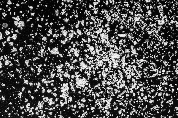 White ashes on a black background. White powder on black background abstract.