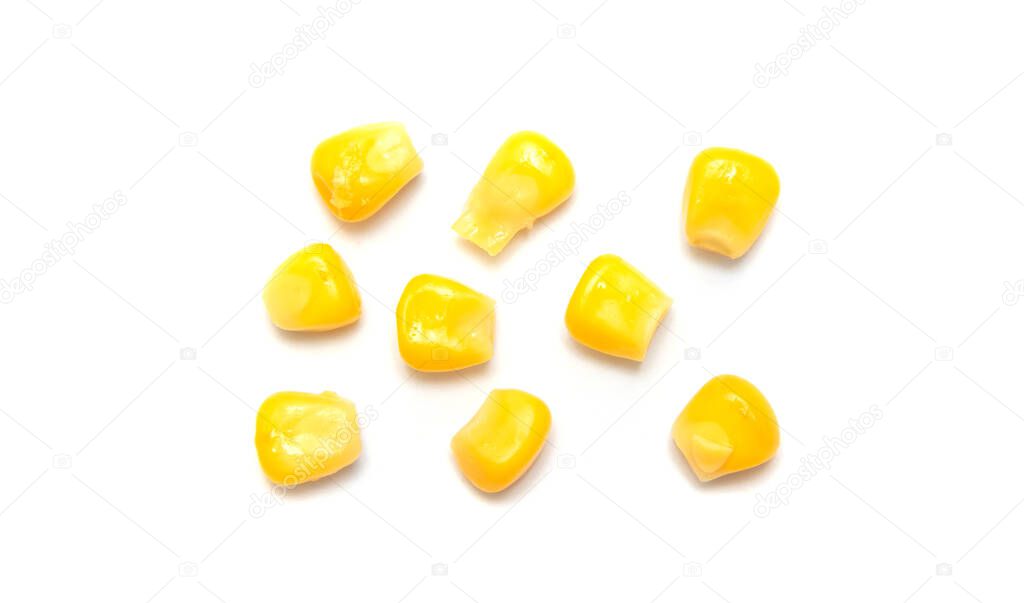 Fresh corn seeds isolated on a white background with a cropped outline, close-up of raw yellow corn grains, harvesting, macro photography.