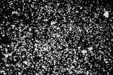 Siyah arka planda beyaz küller. Siyah arkaplanda beyaz toz soyut.