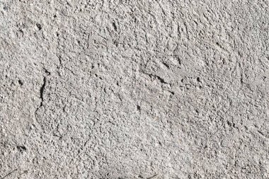 Pürüzlü doku, beton duvar, gri zemin.